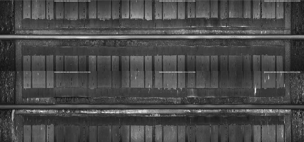 Downward-facing video frame of railroad track